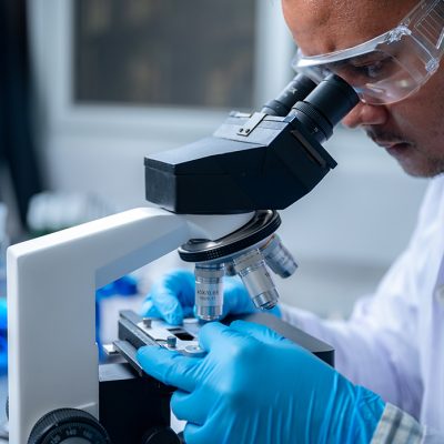 Science and medicine, scientist analyzing and dropping a sample into a glassware, experiments containing chemical liquid in laboratory on glassware, DNA structure, innovative and technology. Science and medicine, scientist analyzing and dropping a sample into a glassware, experiments containing chemical liquid in laboratory on glassware, DNA structure, innovative and technology.